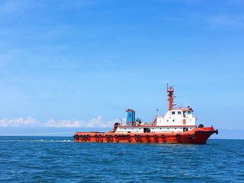 Scenic view of sea against blue sky