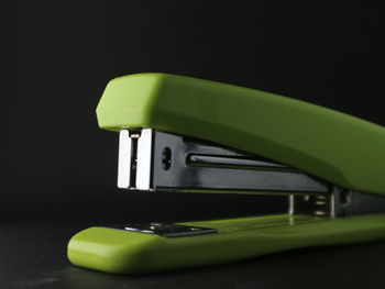 Close-up of vintage car on table against black background