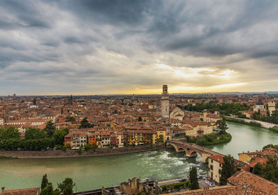 High angle view of river and buildings in city