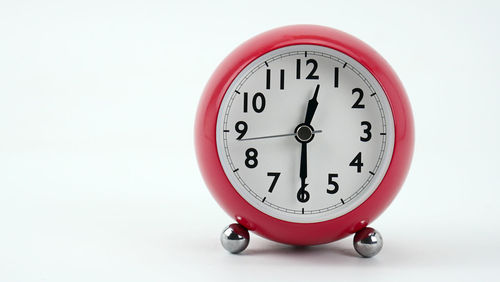 Close-up of clock on white background