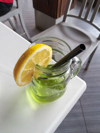 High angle view of lemon in glass on table