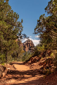 Rock formations on landscape against sky