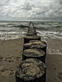 Scenic view of sea against cloudy sky