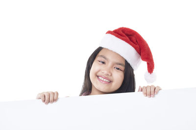 Portrait of smiling boy against white background