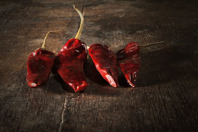 Close-up of red chili peppers on table