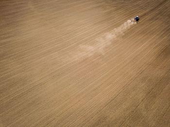 Aerial view of tractor on agricultural field