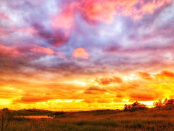 Scenic view of dramatic sky during sunset