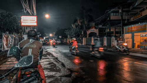 Cars on city street at night
