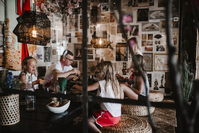Father with daughters in restaurant