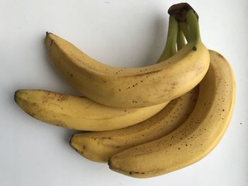 High angle view of bananas on white table