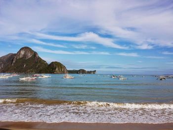 Scenic view of sea against cloudy sky