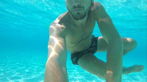 Man swimming in sea