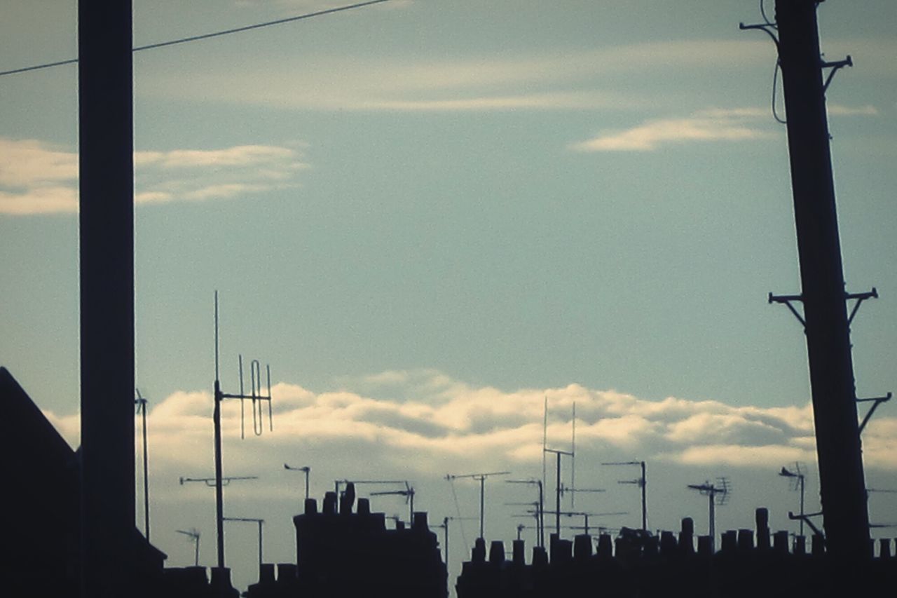 SILHOUETTE CITY BUILDINGS AGAINST SKY DURING SUNSET