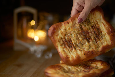 Close-up of person preparing food on table
