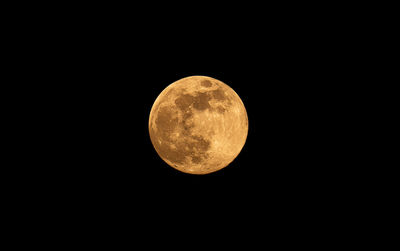 Low angle view of moon against sky at night