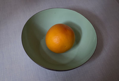 High angle view of orange fruit in bowl