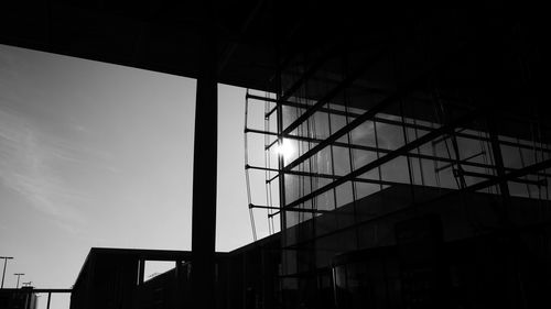 Low angle view of silhouette buildings against sky at dusk