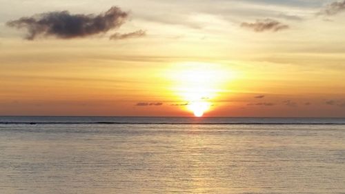 Scenic view of sea at sunset