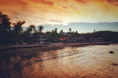 Scenic view of beach against sky during sunset