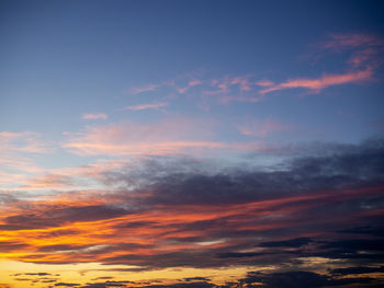 Low angle view of dramatic sky during sunset