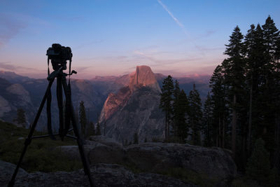 Scenic view of rocks against sky during sunset