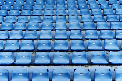 Empty blue colored stadium seats