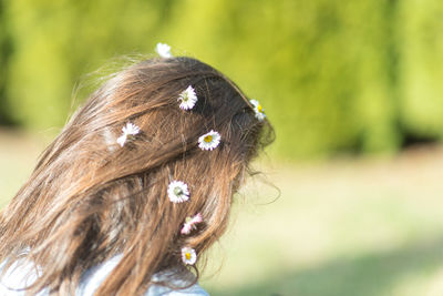 Close-up portrait of a beautiful woman with flower head