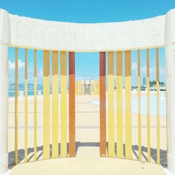 Multi colored sand on beach against sky