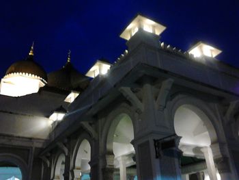 Low angle view of illuminated street light at night