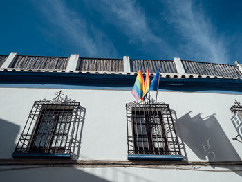 Low angle view of buildings against blue sky