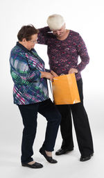 Couple standing against white background