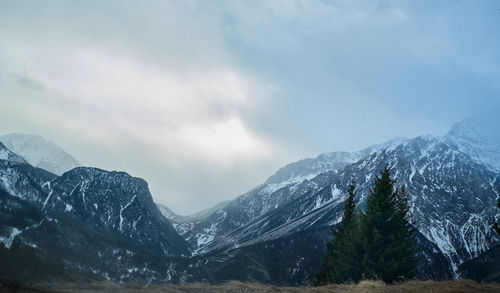 Scenic view of snowcapped mountains against sky