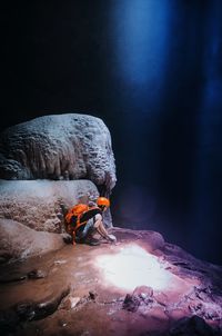 Man working on rock