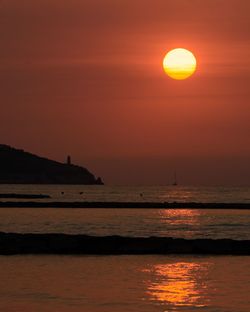 Scenic view of sea against sky during sunrise over torre colomera. benicàssim, spain.