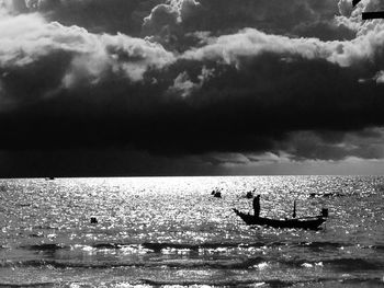 Scenic view of sea against cloudy sky