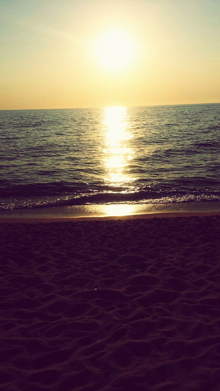 sea, water, horizon over water, sunset, beach, tranquil scene, scenics, tranquility, beauty in nature, sun, shore, idyllic, nature, sand, sky, orange color, rippled, reflection, sunlight, seascape