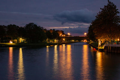 Scenic view of river against sky at night