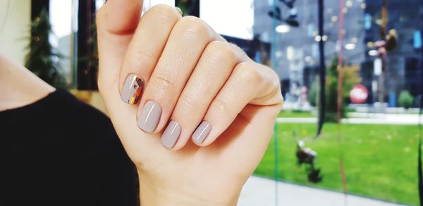 Cropped image of hand with nail polish