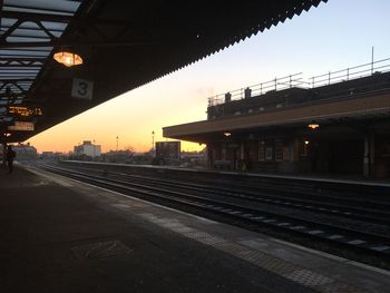 Railroad station platform at sunset