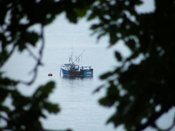 Ship in sea against sky