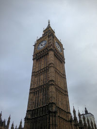 Low angle view of clock tower against sky