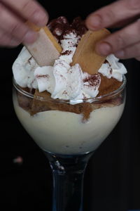 Close-up of hand holding ice cream