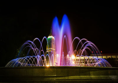 Low angle view of fountain at night