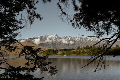 Scenic view of lake against sky during winter