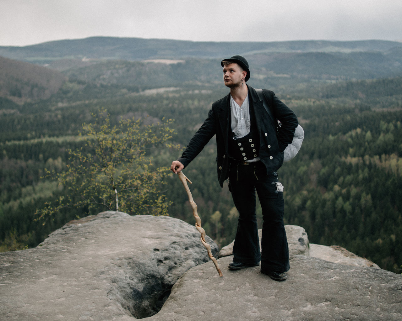 FULL LENGTH OF A MAN STANDING ON ROCKS