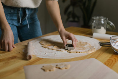 Young woman making christmas cookies