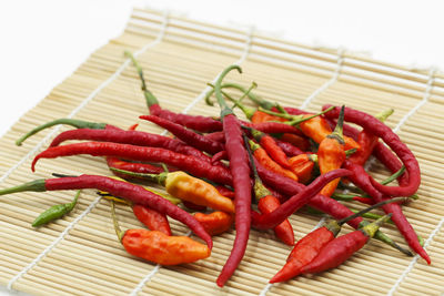 Close-up of red chili peppers on table