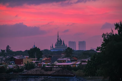 Panoramic view of buildings against sky during sunset