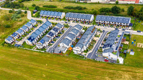 High angle view of people walking on grassy field