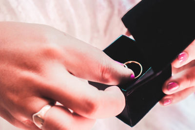 Close-up of woman holding hands